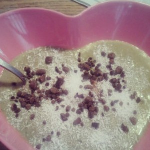 Smoothie in a bowl for lunch. Spinach+peanut flour+chocolate Sunwarrior+1/4 avocado+shredded coconut+cacao nibs. 